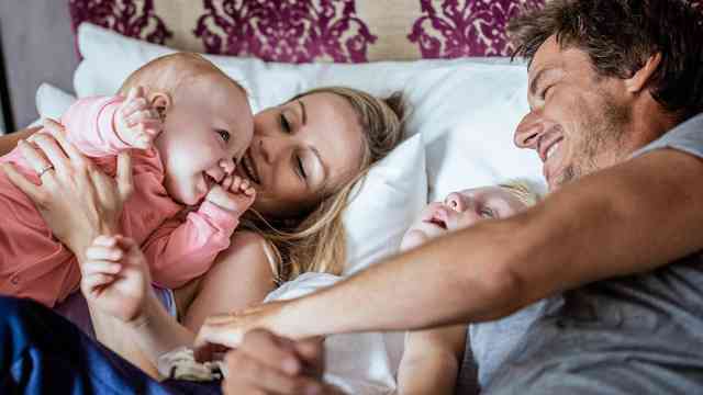 Couple with their young children