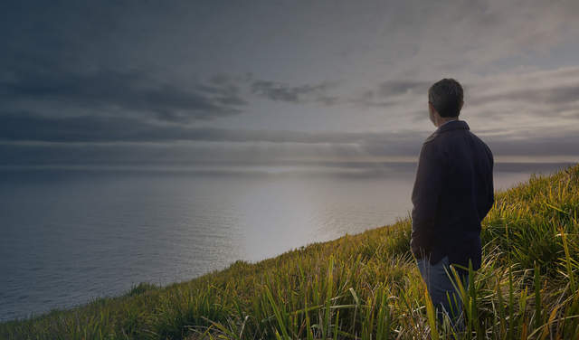 Man looking towards horizon