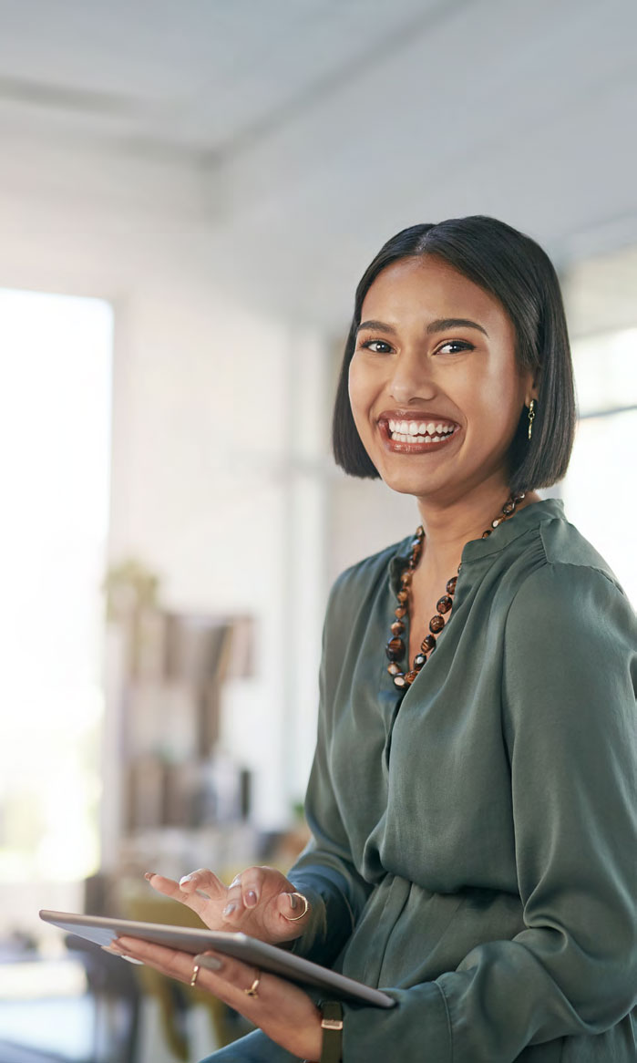 woman in an office holding a touchpad
